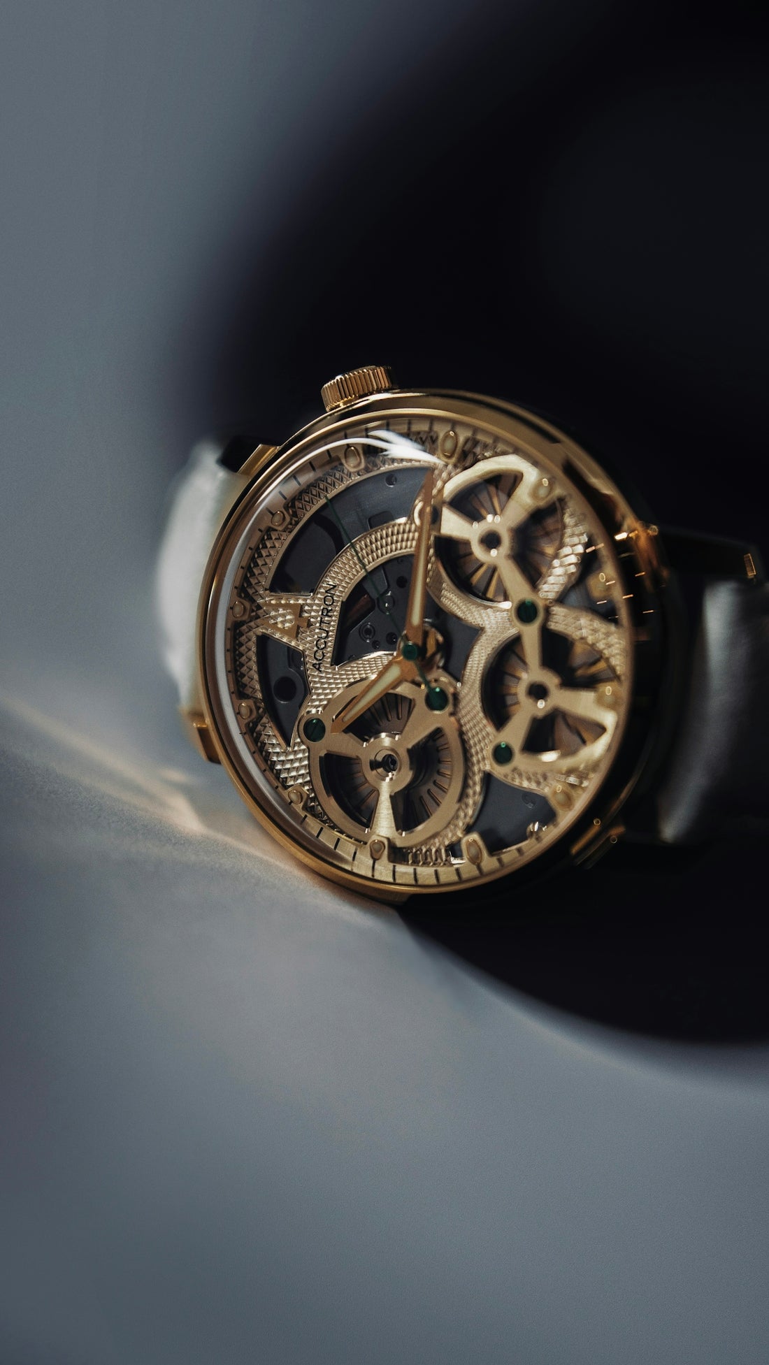 A luxurious, golden watch with an open mechanism.