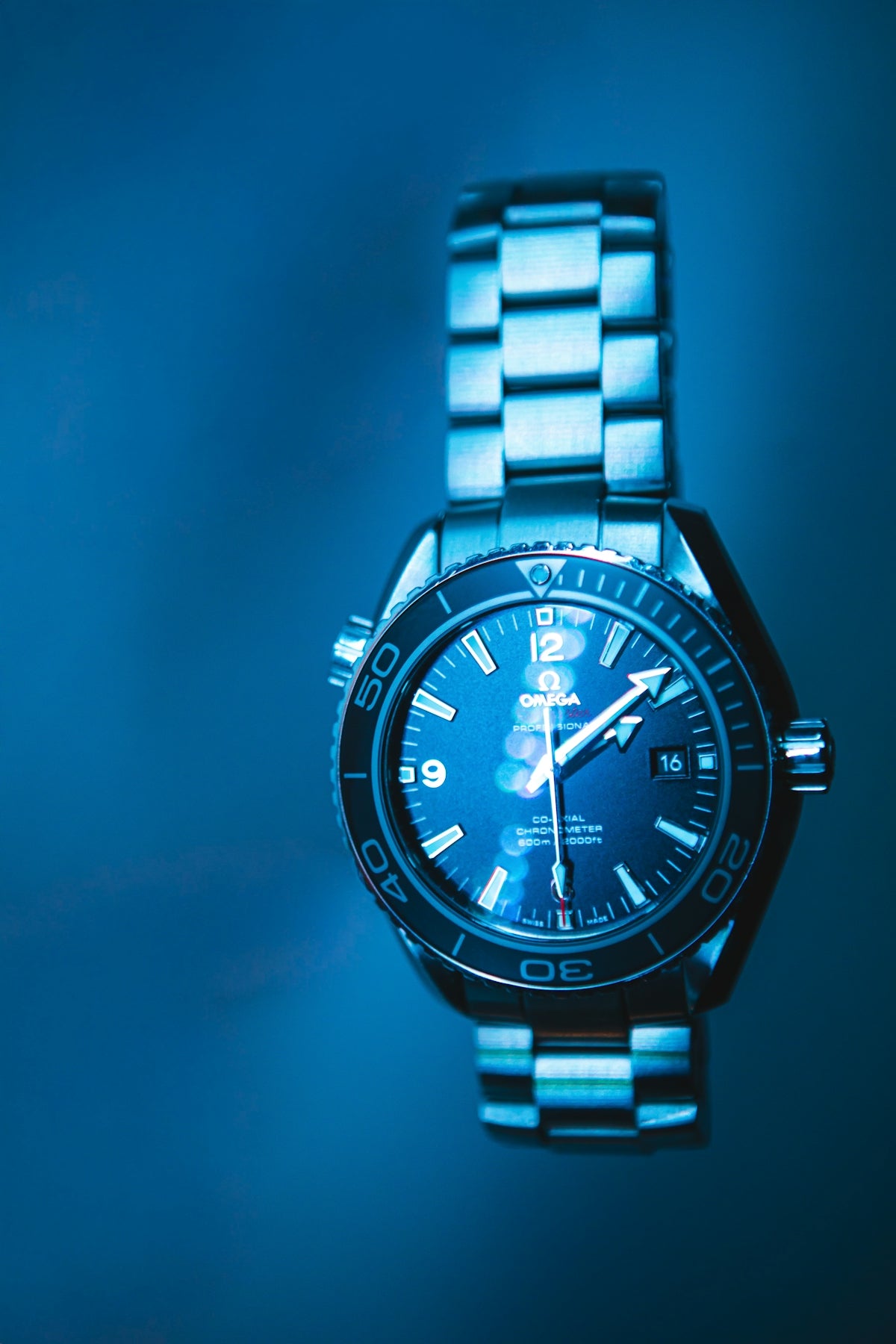 A close-up of a luxury blue watch