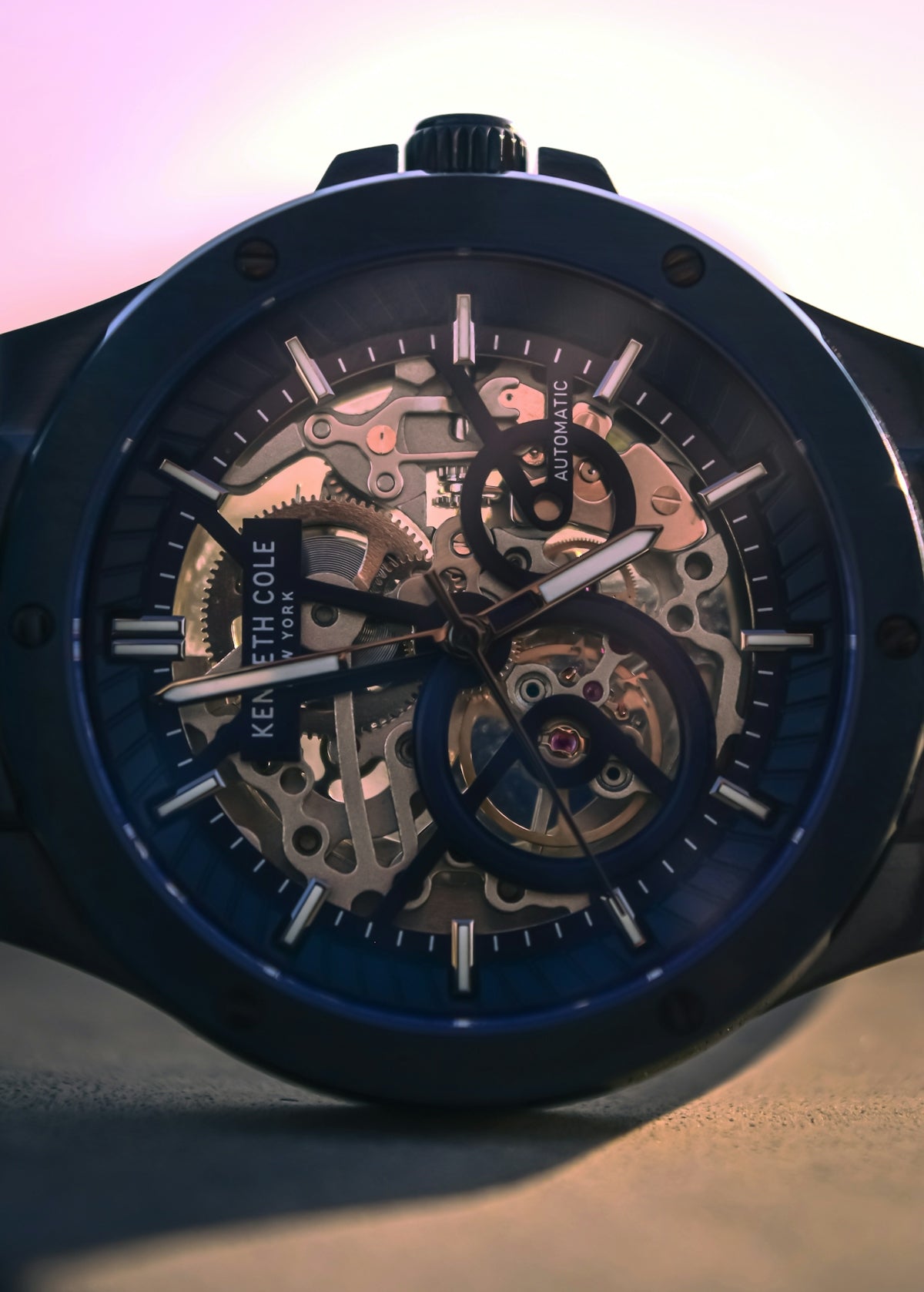Dark skeleton watch displaying intricate automatic movement.