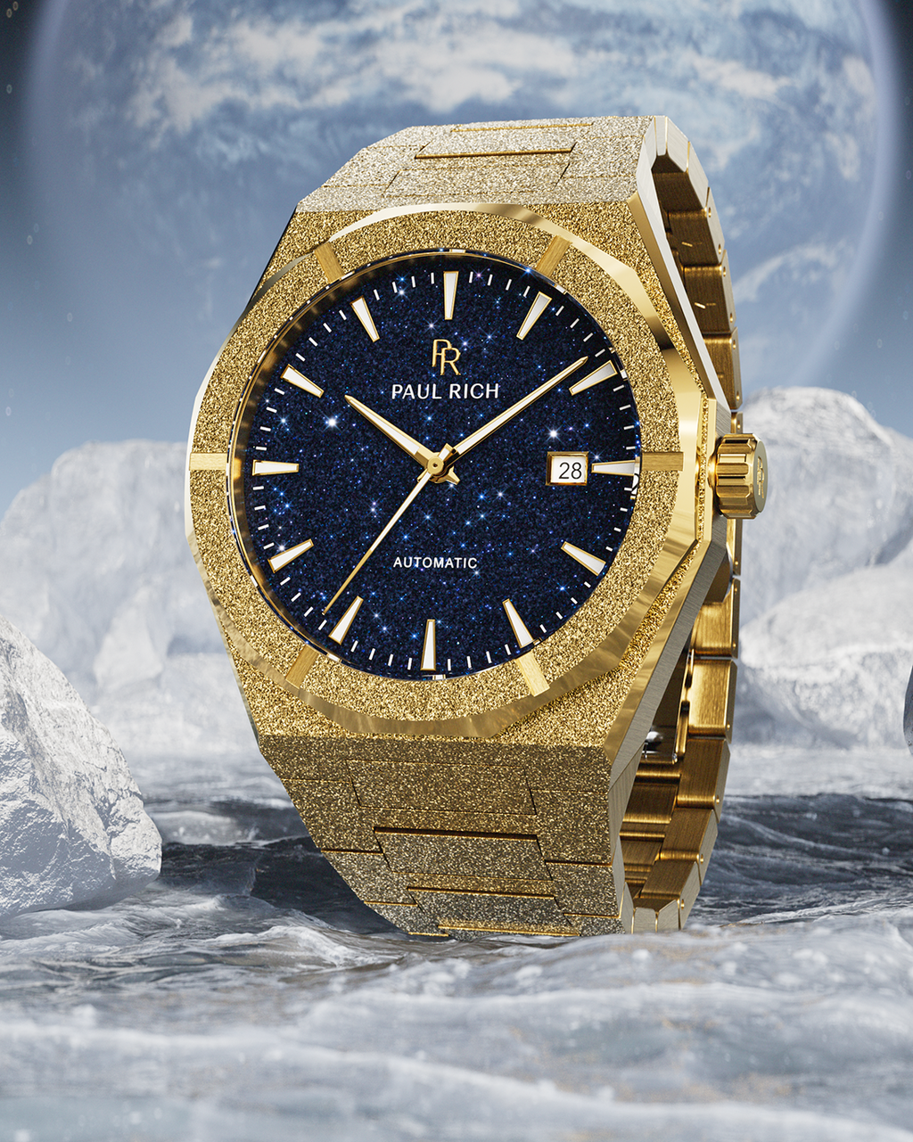 Gold watch with a blue face on a rocky surface