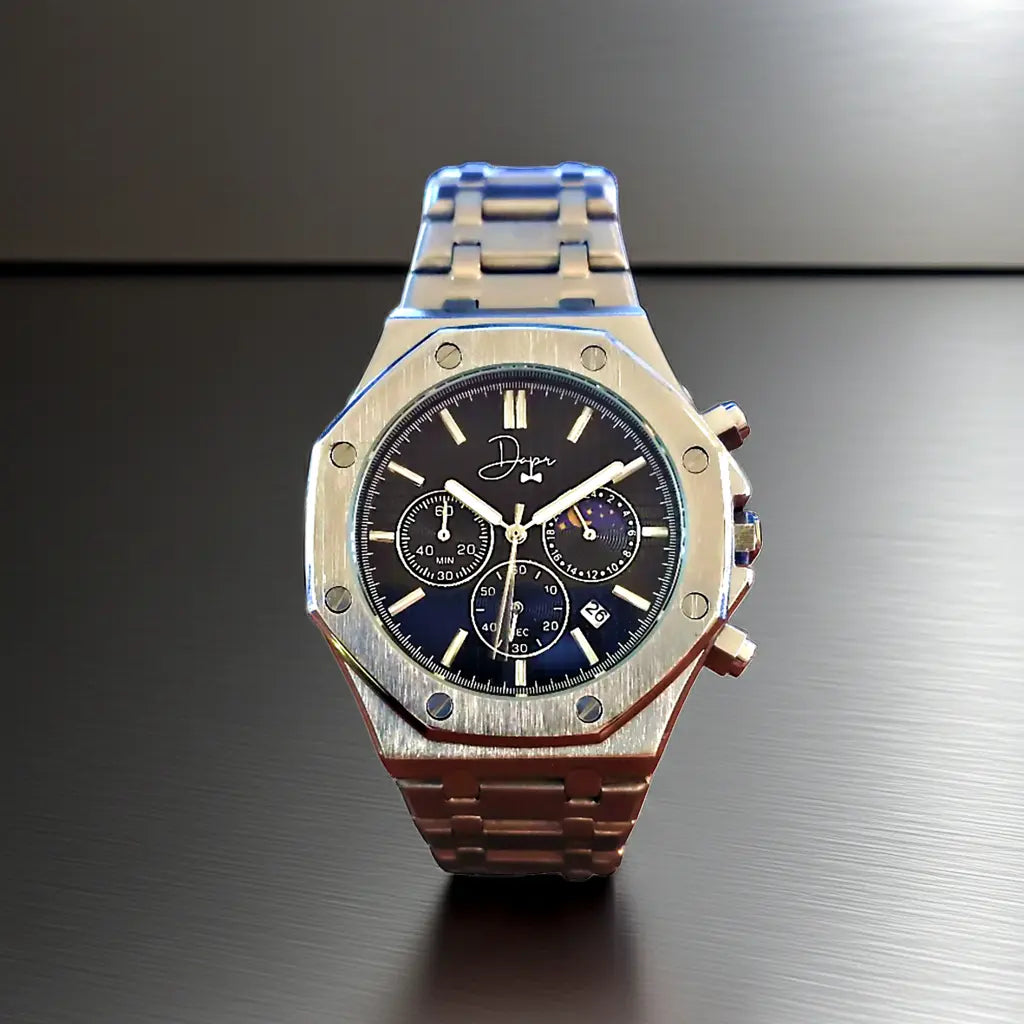 A sleek, two-tone stainless steel chronograph watch with a dark blue dial featuring multiple subdials and a moon phase indicator.