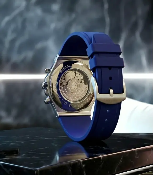 A sleek blue rubber strap watch with a transparent back revealing its intricate gold-toned automatic movement and silver-tone case.